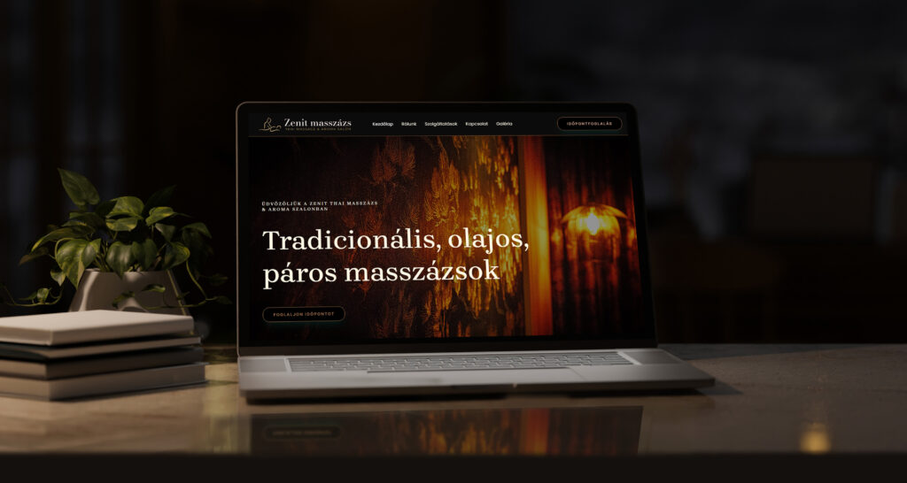 Zenit Masszázs Stúdió modern, sötét eleganciájú weboldala egy laptop kijelzőjén, "Tradicionális, olajos, páros masszázsok" felirattal.